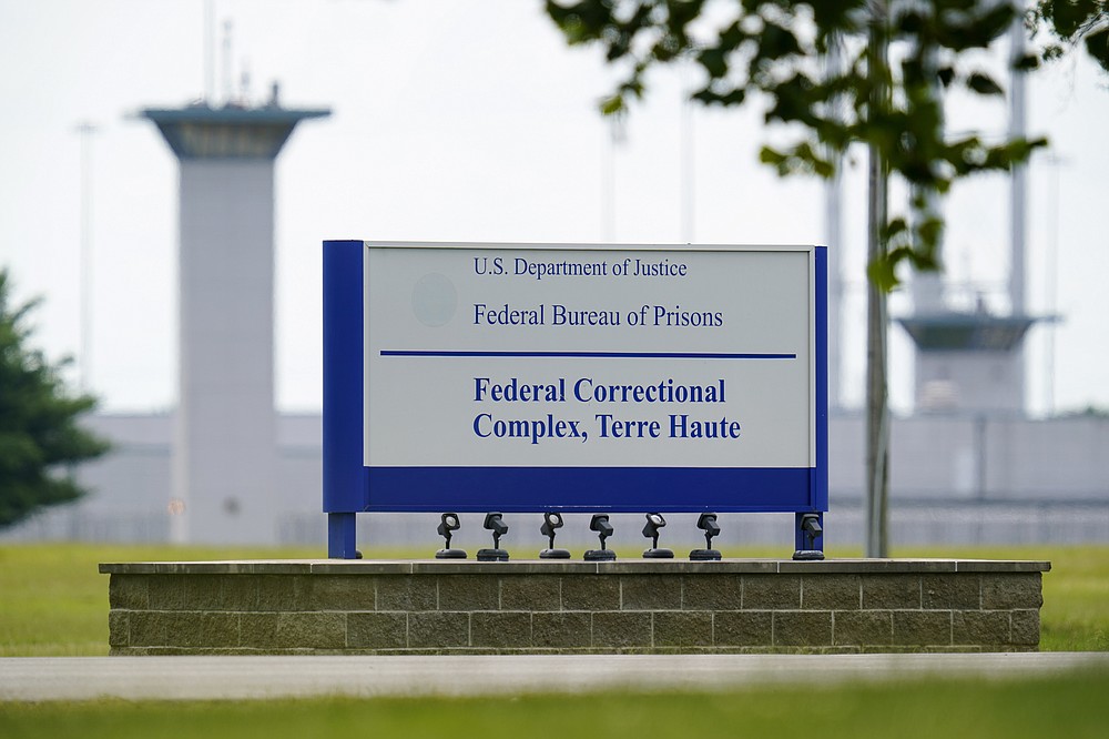 FILE - This Aug 28, 2020 file photo shows the federal prison complex in Terre Haute, Indiana.  The Trump administration plans to continue its unprecedented streak of post-election executions on Friday, December 11, by killing Alfred Bourgeois.  A Louisiana truck driver who severely abused his 2-year-old daughter for weeks in 2002, and then killed her by banging her head on the window and dashboard of a truck.  (AP Photo / Michael Conroy, File)