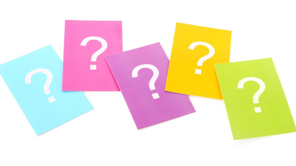 Five colored rectangular cards, each with a white question mark