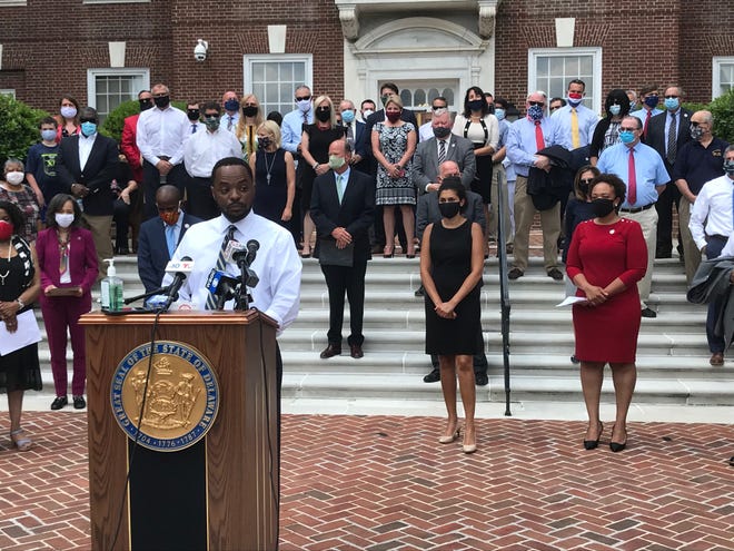 Senator Darius Brown, D-Wilmington (front), is joined by fellow lawmakers at a press conference outside the Legislative Hall in June to announce proposals to amend police and civil rights laws in response to protests against police brutality.