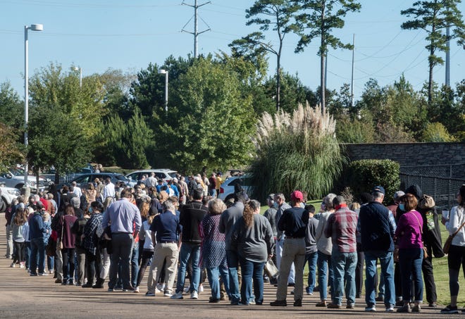 Hundreds of Rankin District residents wait in line to cast their votes at the Word of Life church in Flowood, Miss. On Election Day, Tuesday, November 3, 2020.