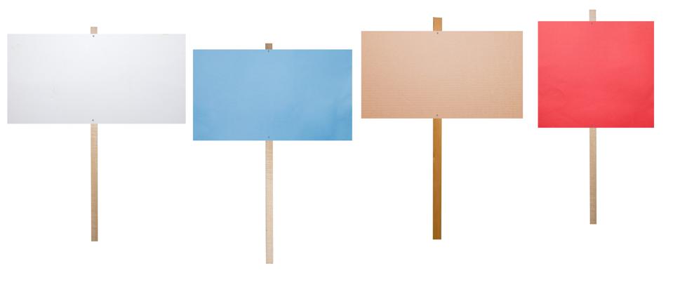 4 blank protest signs of different colors on a white background