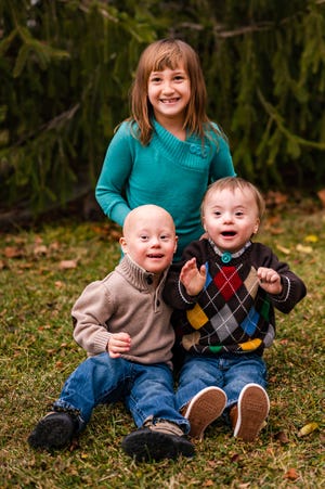 Kaiden (left) and Trenin Duff, twins, pictured with their older sister Kearsley.