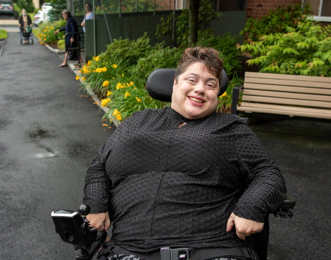 Christina Parissi navigates the city in a wheelchair and has asked the city council to pay more attention to pavement repairs.